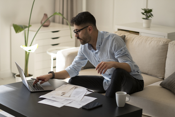 A parent calculating how much money he could get back with he earned income tax credit (EITC).