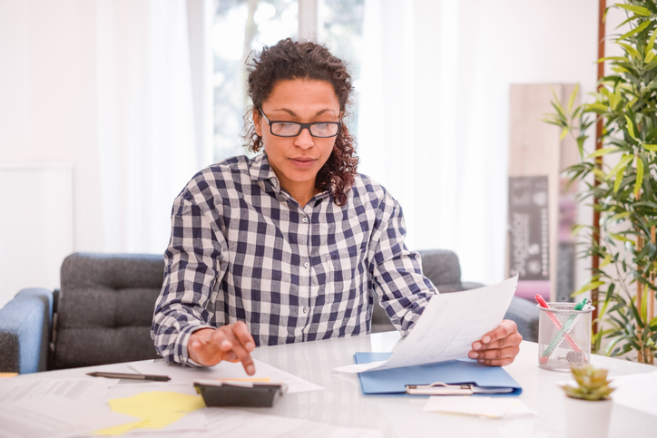 A woman preparing documents for a tax audit.