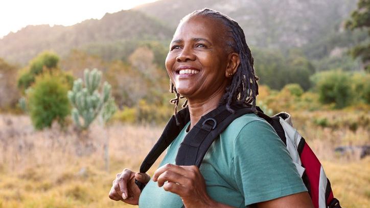 A new retiree enjoys a hike in the desert.