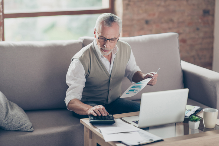 A man researches how to max out a 401k. 