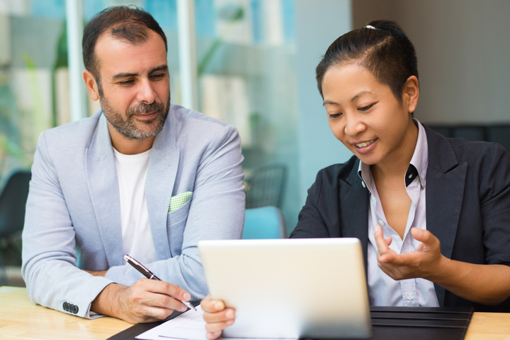 A man meeting with a financial advisor to review his retirement plan.